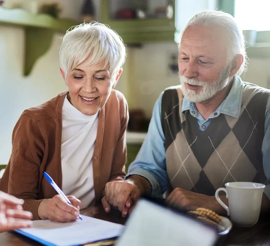 Elderly couple in meeting