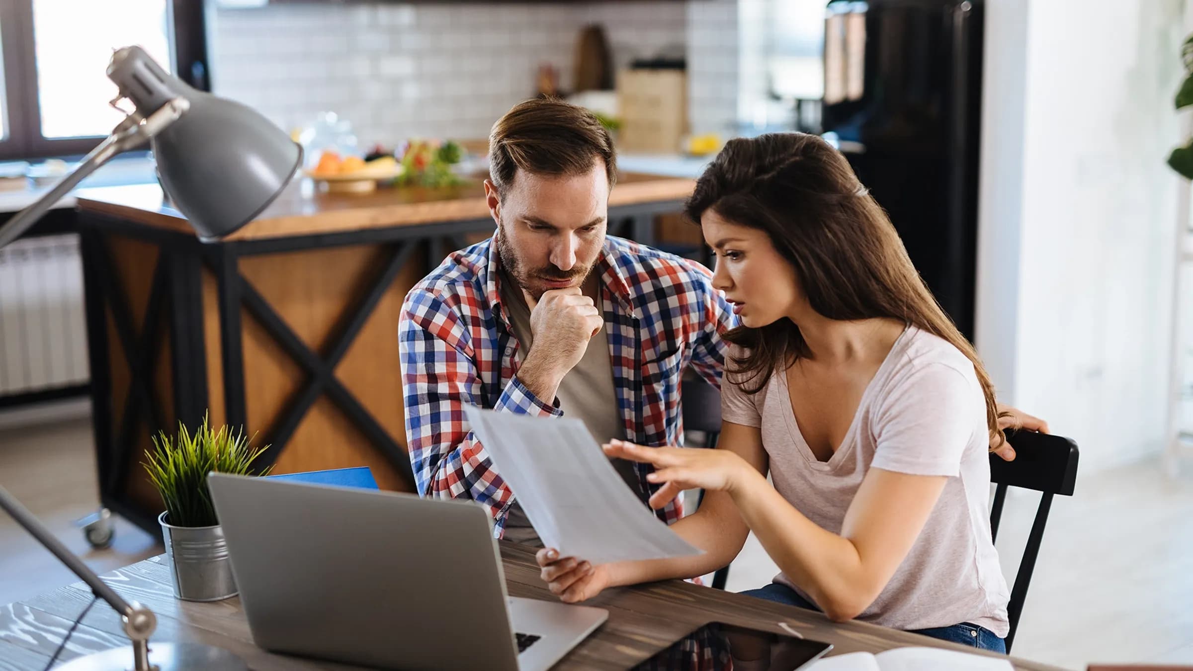 Confused couple on computer