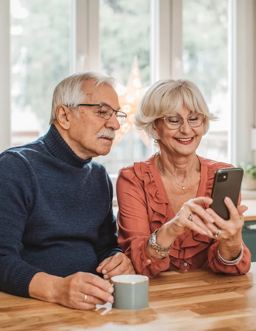Elderly couple in meeting