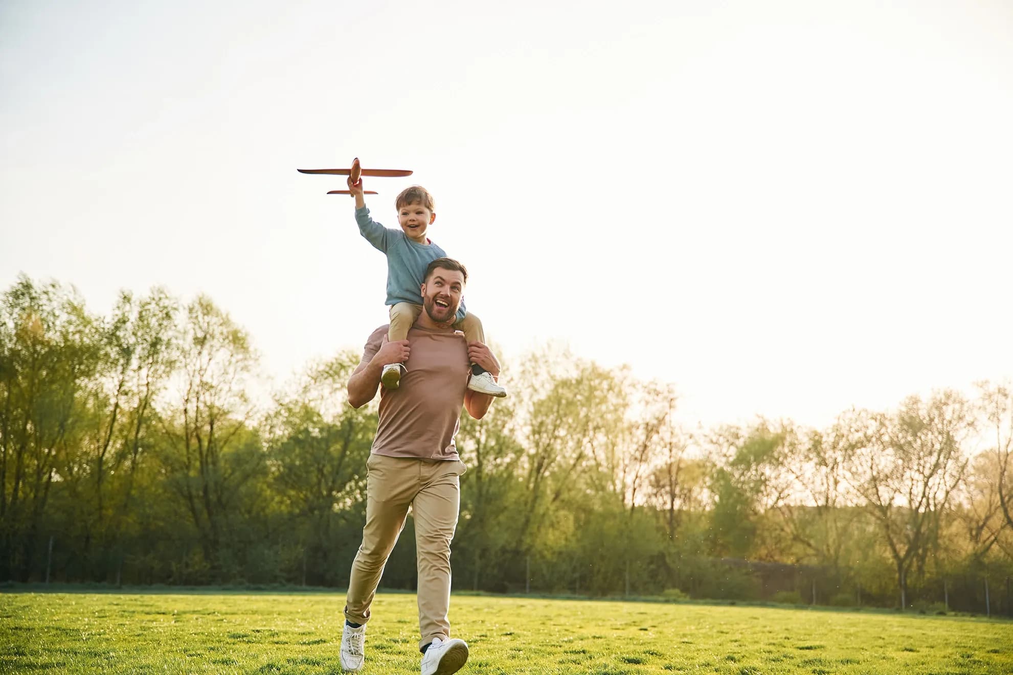 Father and son in park playing
